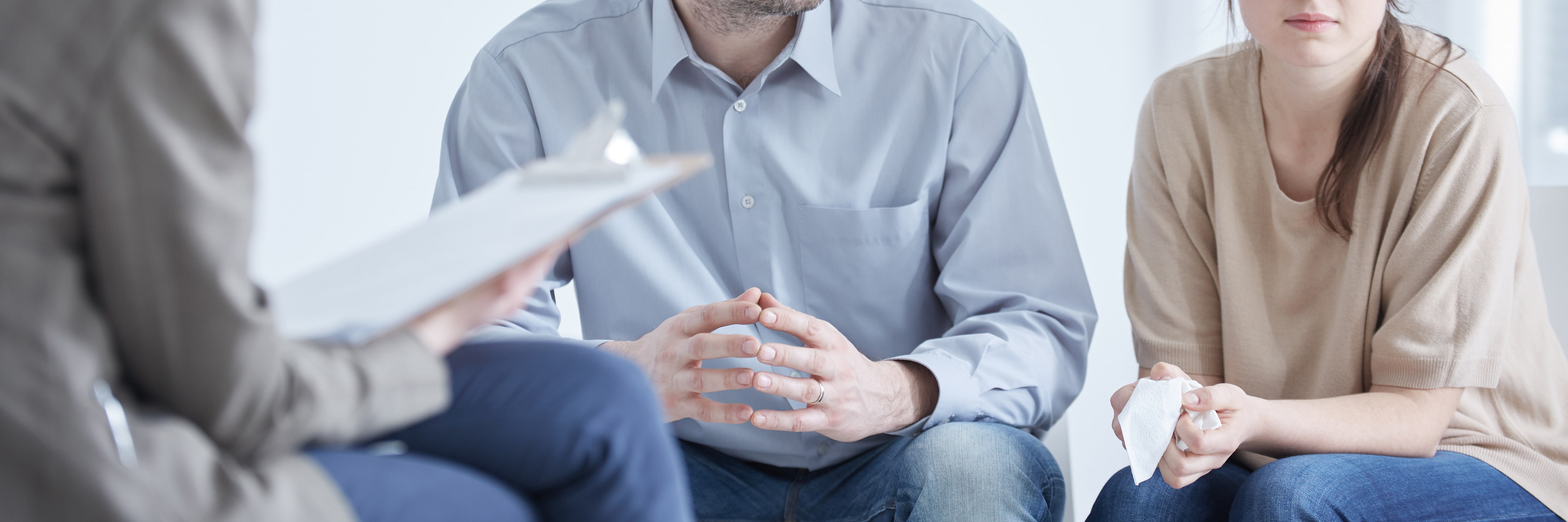 couple sitting with mediator